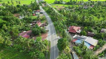 Aerial look down asphalt road at Kuala Muda, Kedah video