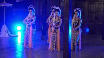 a group of Sundanese dancers take part in a traditional dance competition in a wooden temple video