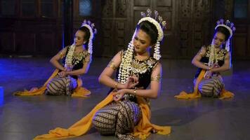 a group of Balinese dancers take part in a dance competition at a festival in a pavilion video