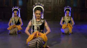 a group of Balinese dancers take part in a dance competition at a festival in a pavilion video