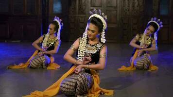 a group of Balinese dancers take part in a dance competition at a festival in a pavilion video