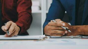 Team of business people working together in the meeting room office, teamwork background charts and graphs banner, double exposure successful teamwork,business planning concept. video