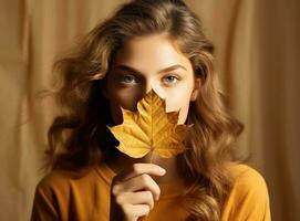 Beautiful girl with autumn leaves photo