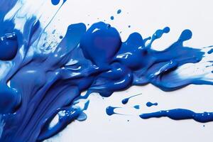 Close up of blue paint shapes on white background with copy space. photo