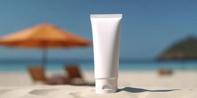 Blank empty white plastic tube. Sunscreen lotion on a sandy beach, summer composition with sunglasses, blue sea as background, copy space. Summer vacation and skin care concept, photo