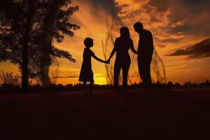 Shadow of Happy family together, parents with their little baby at sunset. A Silhouette of Love and Unity. photo