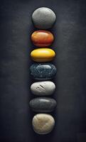 Some colorful stones are displayed, dark navy and yellow, photo