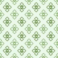 Ethnic geometric fabric pattern Cross Stitch.Ikat embroidery Ethnic oriental Pixel pattern four leaf clover green background. Abstract,vector,illustration. Texture,clothing,frame,motifs,wallpaper. vector
