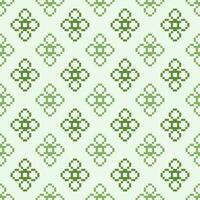 Ethnic geometric fabric pattern Cross Stitch.Ikat embroidery Ethnic oriental Pixel pattern four leaf clover green background. Abstract,vector,illustration. Texture,clothing,frame,motifs,wallpaper. vector