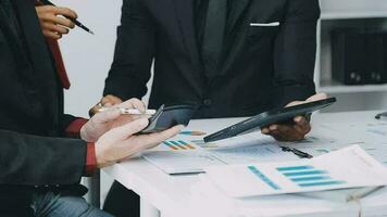 Team of business people working together in the meeting room office, teamwork background charts and graphs banner, double exposure successful teamwork,business planning concept. video