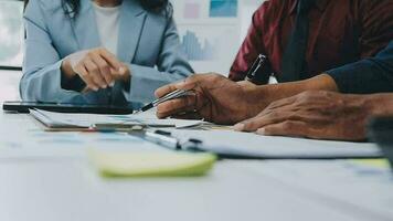 Team of business people working together in the meeting room office, teamwork background charts and graphs banner, double exposure successful teamwork,business planning concept. video