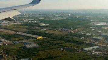 View from the porthole to the city. Passenger flight. Saint Petersburg, landing video