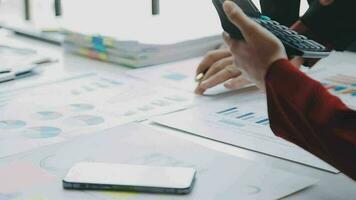 Team of business people working together in the meeting room office, teamwork background charts and graphs banner, double exposure successful teamwork,business planning concept. video