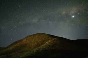 Starry night and mountains photo