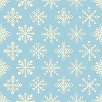Seamless pattern with white snowflakes on light blue background vector