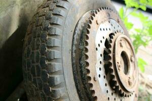 rusty old vespa motorbike tire wheel gears photo