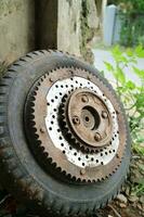 rusty old vespa motorbike tire wheel gears photo