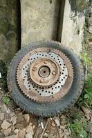 rusty old vespa motorbike tire wheel gears photo