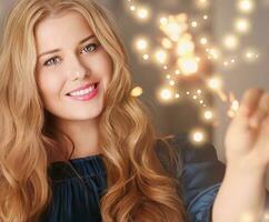 Holiday magic, Christmas and New Year celebration, happy woman with sparklers photo