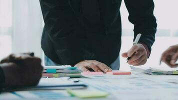 Team of business people working together in the meeting room office, teamwork background charts and graphs banner, double exposure successful teamwork,business planning concept. video
