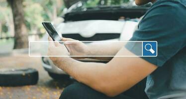 Searching browsing internet bar over background is Asian man using a smartphone for assistance after a car breakdown on street. Searching Browsing Internet Data Information Networking Concept photo