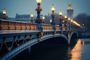 This stock photo captures a picturesque night scene featuring a bridge with street lights