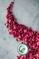 luxe face cream and rose petals - cosmetics with flowers styled beauty concept photo