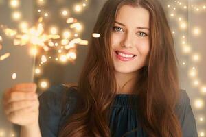 Holiday magic, Christmas and New Year celebration, happy woman with sparklers photo