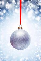 Christmas bauble on a snowy winter background, Merry Christmas and Happy Holidays wishes, generative ai photo