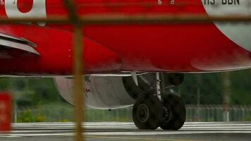 PHUKET, THAILAND NOVEMBER 28, 2017 - Commercial aircraft low cost airline Air Asia Airbus A320 , HS BBN detailed close up on engine and landing gear video