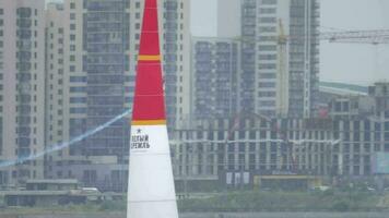 KAZAN, RUSSIAN FEDERATION, JUNE 14, 2019 - Sports plane flies in the sky and flips over. Loop in the sky, extreme stunt pilots at the Red Bull airshow in Kazan video