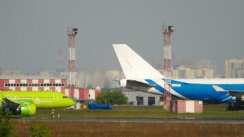 NOVOSIBIRSK, RUSSIAN FEDERATION JUNE 10, 2020 - Airbus A320 of S7 airlines rides across the airfield at Tolmachevo International Airport, Novosibirsk OVB. video