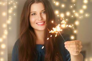 Holiday magic, Christmas and New Year celebration, happy woman with sparklers photo