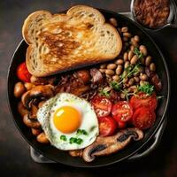 Inglés desayuno con huevos, tocino y frijoles foto