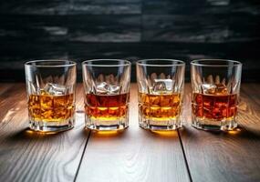 Alcohol drinks on wooden table photo