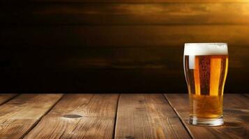 Cold beer glass on wooden background photo