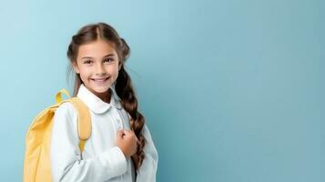 Happy school girl with backpack photo