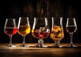 Alcohol drinks on wooden table photo