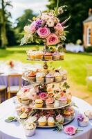 Cupcakes, cakes, scones and muffins and holiday decoration outdoors at the English country style garden, sweet desserts for wedding, birthday or party celebration, generative ai photo