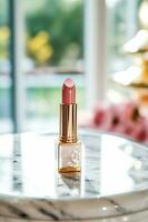 Luxurious pink lipstick in golden tube on marble, beauty cosmetic and luxury make-up product, generative ai photo