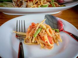 Eating papaya salad som tam thai photo