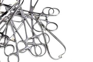 Surgical instruments on white background photo