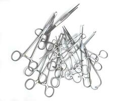 Surgical instruments on white background photo