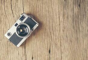 vintage old film camera on wood board photo