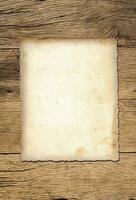 Old paper texture background on wood board photo