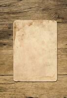 Old paper texture background on wood board photo