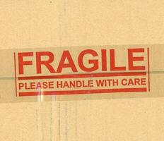 fragile handle with care brown corrugated cardboard box photo