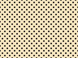 black polka dots over bisque background photo