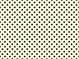 black polka dots over beige background photo