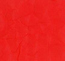 crumpled red paper texture background photo